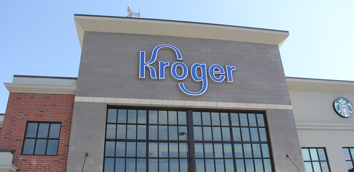 Photo of the new Kroger Marketplace, with a glass front entrance and a larger Kroger sign.